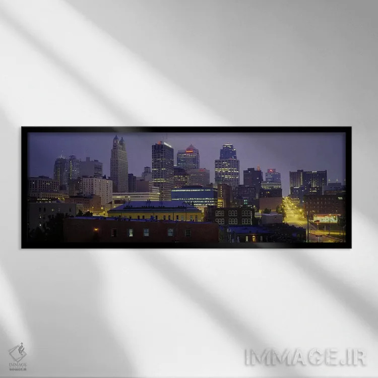 تابلو Missouri, USA,ساختمانهای روشن در غروب، کانزاس سیتی، میزوری، ایالات متحده اثر پانورامیک ایمجز (استودیو عکاسی عریض) - نمای قابدار مشکی
