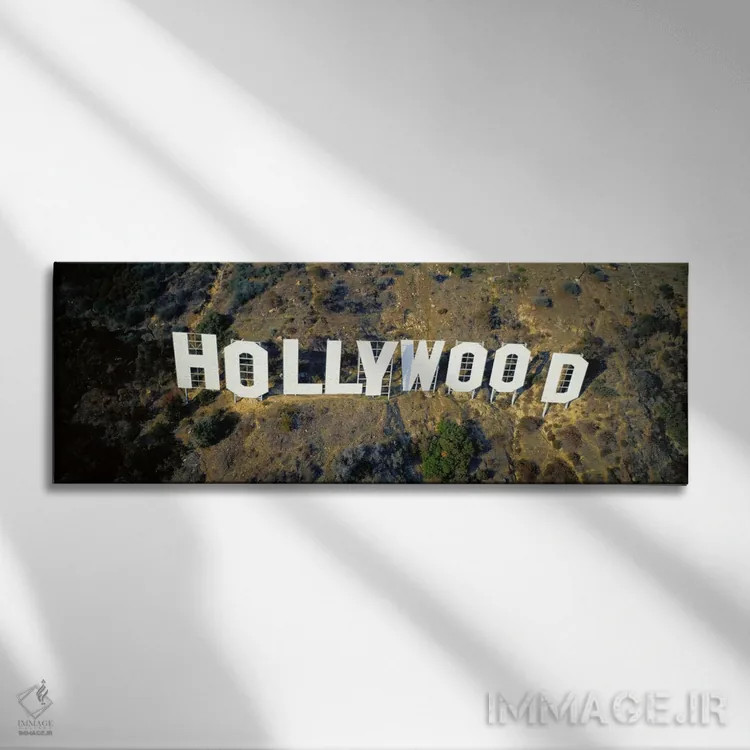 تابلو California, Los Angeles, Aerial view of Hollywood Sign at Hollywood Hills,ایالات متحده، کالیفرنیا، لسآنجلس، نمای هوایی تابلو هالیوود در تپههای هالیوود اثر پانورامیک ایمجز (استودیو عکاسی عریض) - نمای روبهرو روی دیوار