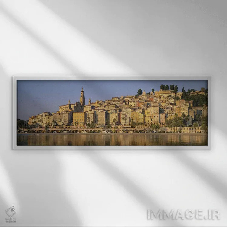 تابلو Eglise St-Michel, Menton, France,ساختمانها در کنار آب، کلیسای سنت میشل، منتون، فرانسه اثر پانورامیک ایمجز (استودیو عکاسی عریض) - نمای قابدار سفید