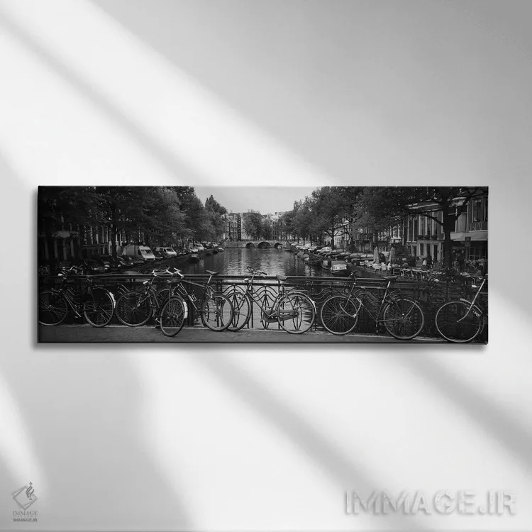 تابلو Amsterdam, Netherlands,دوچرخهای تکیه دادهشده به نرده فلزی روی یک پل، آمستردام، هلند اثر پانورامیک ایمجز (استودیو عکاسی عریض) - نمای روبهرو روی دیوار