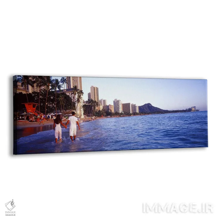 تابلو Waikiki Beach, Honolulu, Oahu, Hawaii, USA,نمای پشت یک زوج در آب راه میروند، ساحل وایکیکی، هونولولو، اوآهو، هاوایی، آمریکا اثر پانورامیک ایمجز (استودیو عکاسی عریض) - نمای پرسپکتیو محصول