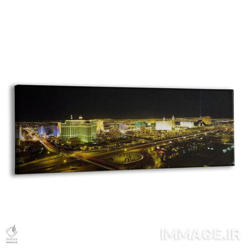 تابلو Nevada, USA,نمای زاویه بالا از ساختمانهای روشنشده در شب، لاس وگاس، نوادا، ایالات متحده آمریکا اثر پانورامیک ایمجز (استودیو عکاسی عریض) - نمای پرسپکتیو محصول