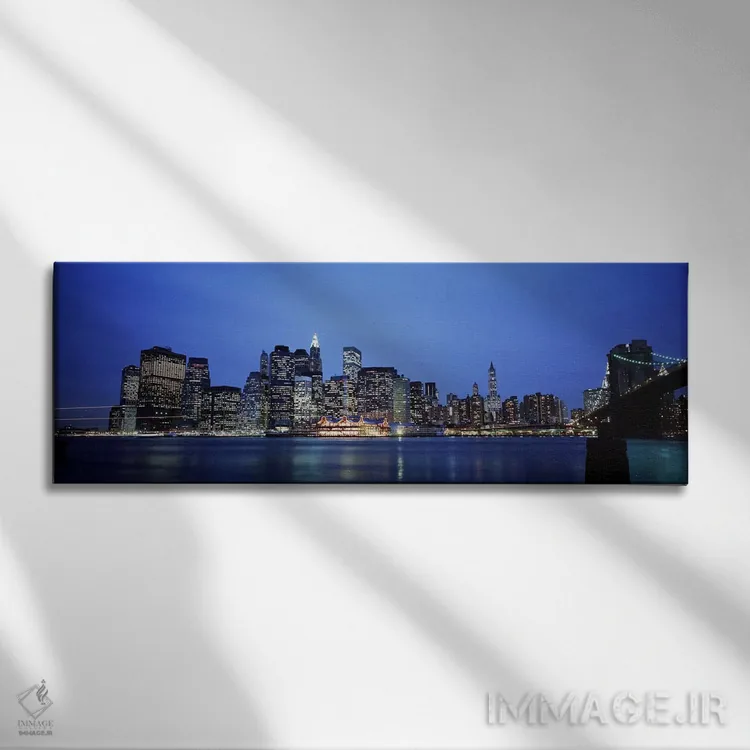 تابلو Manhattan, New York City, New York State, USA,ساختمانهای کنار آب، منهتن، نیویورک سیتی، ایالت نیویورک، ایالات متحده آمریکا اثر پانورامیک ایمجز (استودیو عکاسی عریض) - نمای روبهرو روی دیوار
