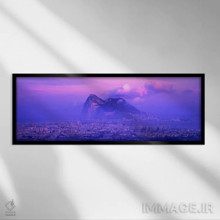 تابلو Rock Of Gibraltar, Iberian Peninsula, Gibraltar,غروب ابری بنفش، صخره جبلالطارق، شبهجزیره ایبری، جبلالطارق اثر پانورامیک ایمجز (استودیو عکاسی عریض) - نمای قابدار مشکی