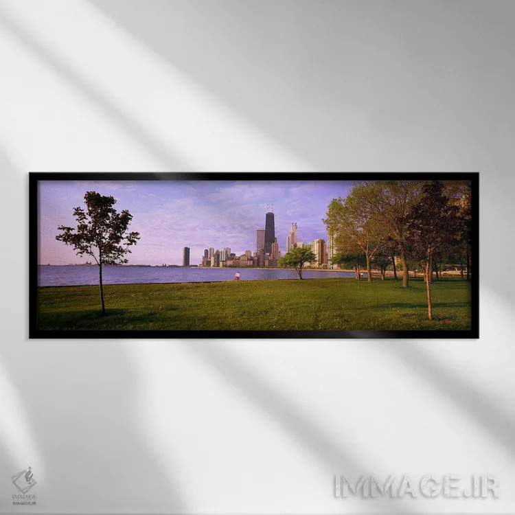 تابلو Lincoln Park, Lake Michigan, Chicago, Illinois, USA,درختان در پارکی با دریاچه و ساختمانها در پسزمینه، پارک لینکلن، دریاچه میشیگان، شیکاگو، ایلینوی، ایالات متحده آمریکا اثر پانورامیک ایمجز (استودیو عکاسی عریض) - نمای قابدار مشکی