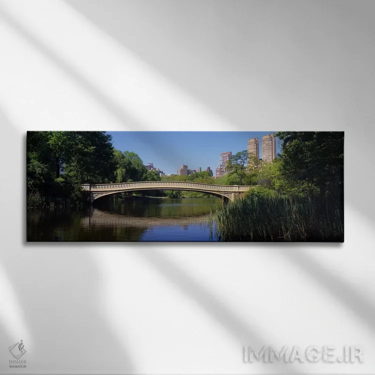 تابلو Central Park, New York City, New York State, USA,پل روی دریاچه، پارک مرکزی، نیویورک سیتی، ایالت نیویورک، ایالات متحده آمریکا اثر پانورامیک ایمجز (استودیو عکاسی عریض) - نمای روبهرو روی دیوار