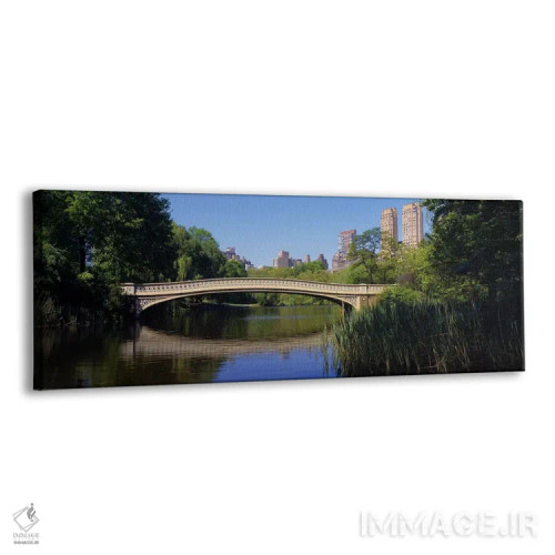 تابلو Central Park, New York City, New York State, USA,پل روی دریاچه، پارک مرکزی، نیویورک سیتی، ایالت نیویورک، ایالات متحده آمریکا اثر پانورامیک ایمجز (استودیو عکاسی عریض) - نمای پرسپکتیو محصول