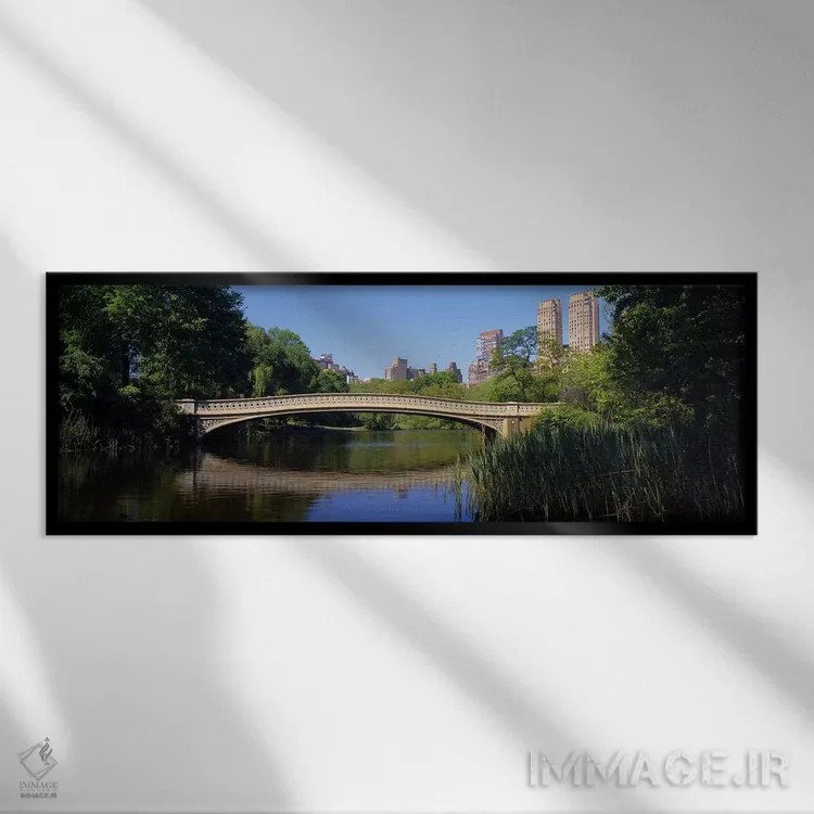 تابلو Central Park, New York City, New York State, USA,پل روی دریاچه، پارک مرکزی، نیویورک سیتی، ایالت نیویورک، ایالات متحده آمریکا اثر پانورامیک ایمجز (استودیو عکاسی عریض) - نمای قابدار مشکی