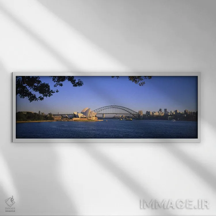 تابلو Sydney, New South Wales, Australia,نمای دور از پل بندر سیدنی و اپرای سیدنی، سیدنی، نیوساوثولز، استرالیا اثر پانورامیک ایمجز (استودیو عکاسی عریض) - نمای قابدار سفید