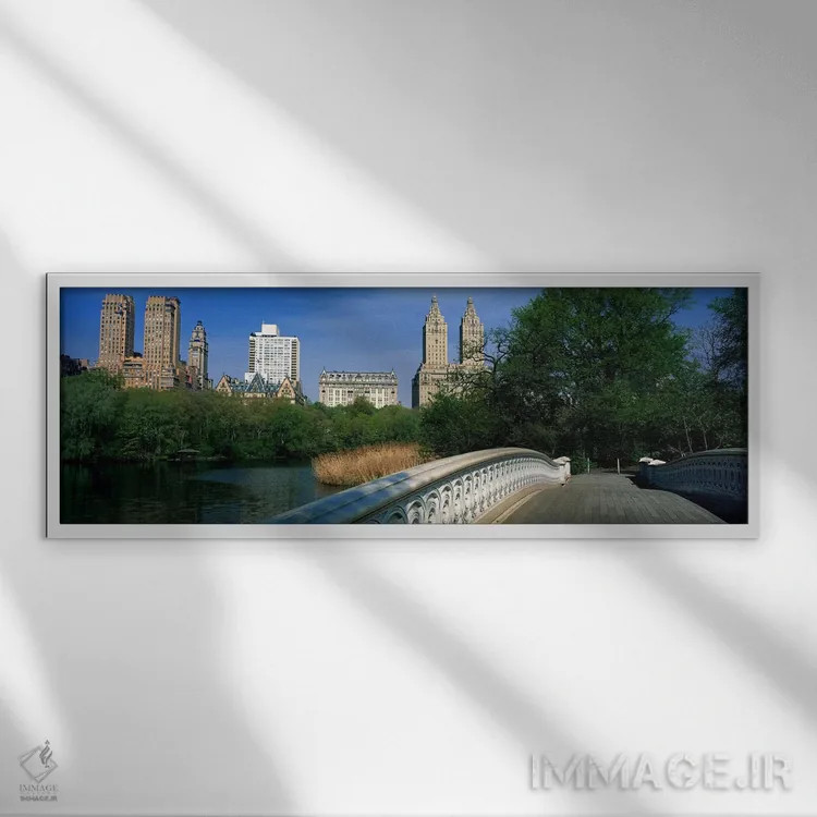 تابلو New York City, New York, USA,نمای ساختمانهای تاریخی در امتداد سنترال پارک غرب از پل بُو، نیویورک اثر پانورامیک ایمجز (استودیو عکاسی عریض) - نمای قابدار سفید