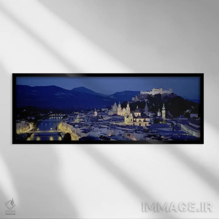 تابلو Salzburg, Austria,نمای زاویه بالا از ساختمانهای شهر، زالتسبورگ، اتریش اثر پانورامیک ایمجز (استودیو عکاسی عریض) - نمای قابدار مشکی