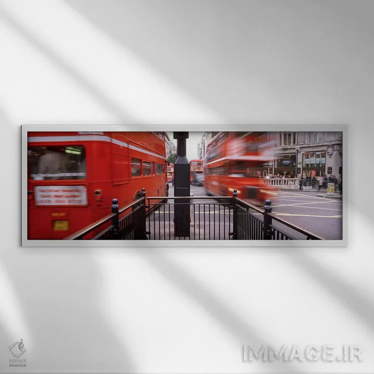 تابلو Oxford Circus Station Circle, London, England,نمای تار حرکت اتوبوسهای دوطبقه، میدان آکسفورد سرکس، لندن، انگلستان اثر پانورامیک ایمجز (استودیو عکاسی عریض) - نمای قابدار سفید