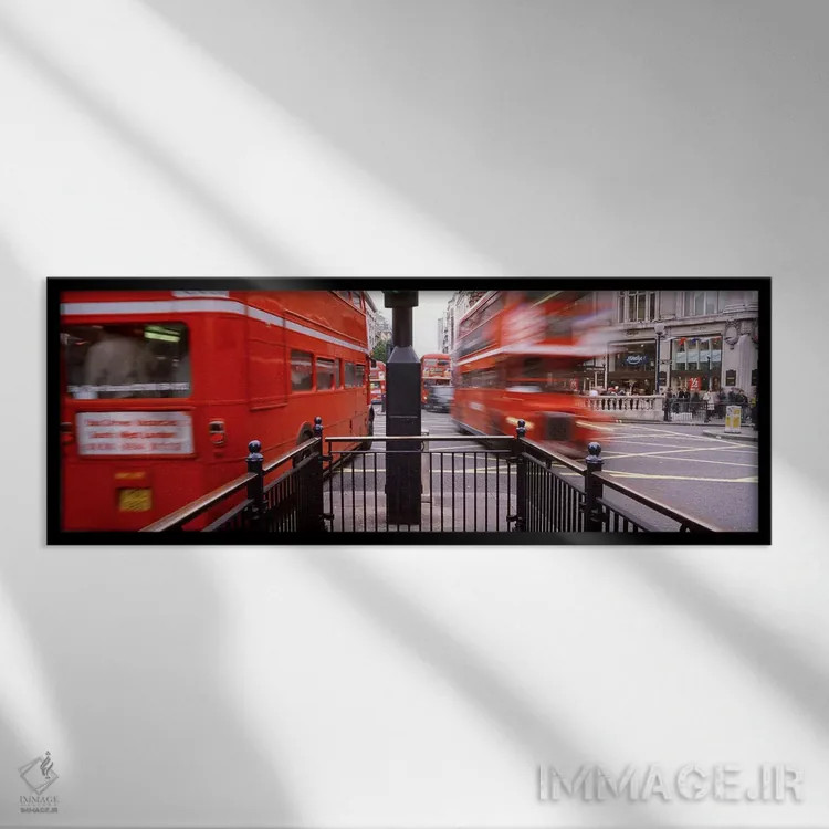 تابلو Oxford Circus Station Circle, London, England,نمای تار حرکت اتوبوسهای دوطبقه، میدان آکسفورد سرکس، لندن، انگلستان اثر پانورامیک ایمجز (استودیو عکاسی عریض) - نمای قابدار مشکی