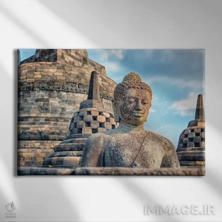 تابلو مجسمه بودا برابودور اثر مانجیک پیکچرز (استودیو عکاسی یا فیلمسازی) - نمای روبهرو روی دیوار