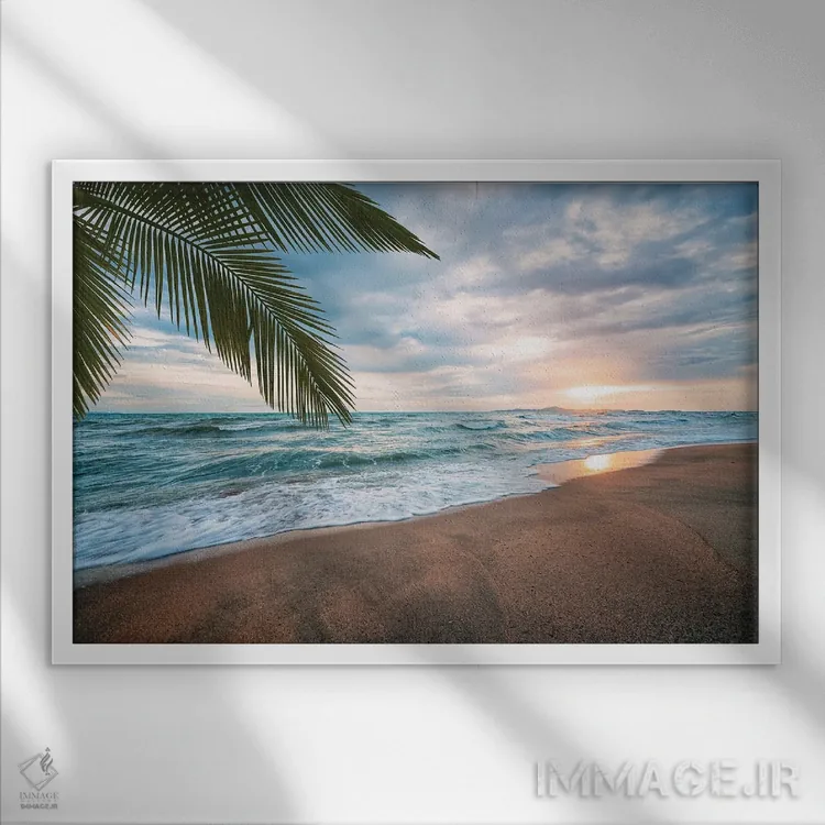 تابلو غروب در ساحل اثر مانجیک پیکچرز (استودیو عکاسی یا فیلمسازی) - نمای قابدار سفید