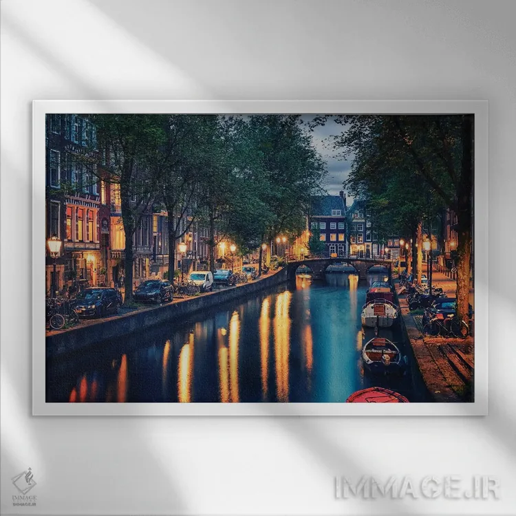 تابلو غروب آمستردام اثر مانجیک پیکچرز (استودیو عکاسی یا فیلمسازی) - نمای قابدار سفید