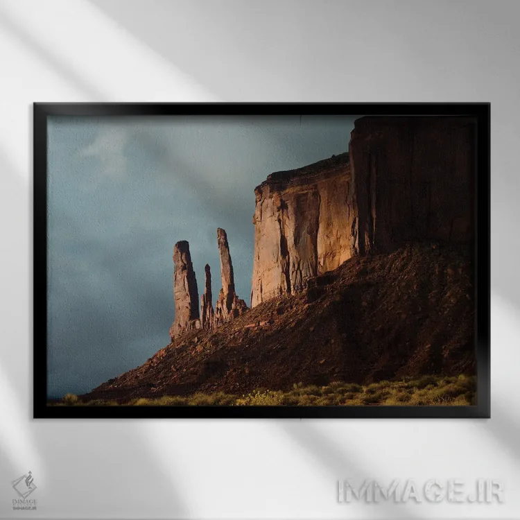 تابلو "آمریکا، آریزونا-یوتا، گولباورگ، پارک قبیلهای ناواهو، دره یادبود، سه خواهر و میز میچل" اثر برنارد فریل - نمای قابدار مشکی