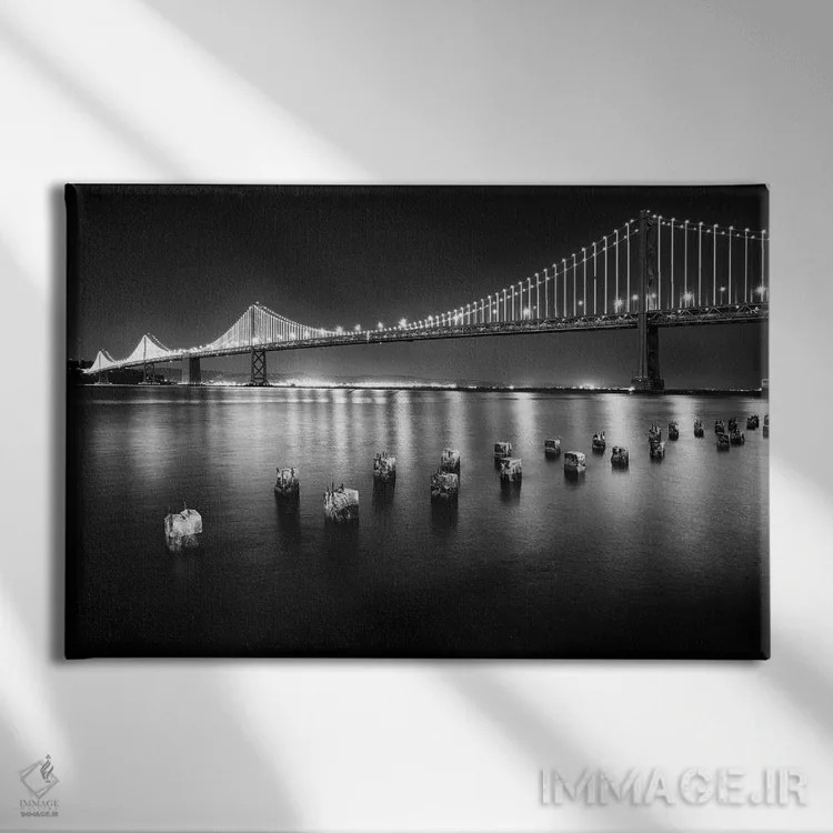 تابلو دکوراتیو پل معلق روشن شده در شب، بخش غربی بی بریج، سان فرانسیسکو، کالی… اثر جورج اوزه - نمای روبهرو روی دیوار