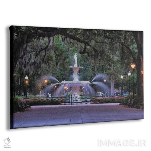 تابلو دکوراتیو نمای فواره پارک فورسایت از لابه لای شاخه های بلوط پوشیده از خ… اثر جورج اوزه - نمای پرسپکتیو محصول