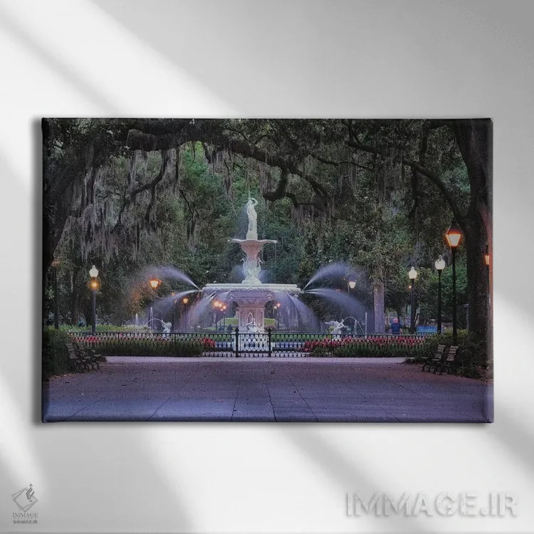 تابلو دکوراتیو نمای فواره پارک فورسایت از لابه لای شاخه های بلوط پوشیده از خ… اثر جورج اوزه - نمای روبهرو روی دیوار