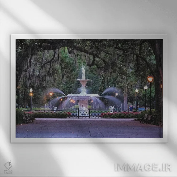 تابلو دکوراتیو نمای فواره پارک فورسایت از لابه لای شاخه های بلوط پوشیده از خ… اثر جورج اوزه - نمای قابدار سفید