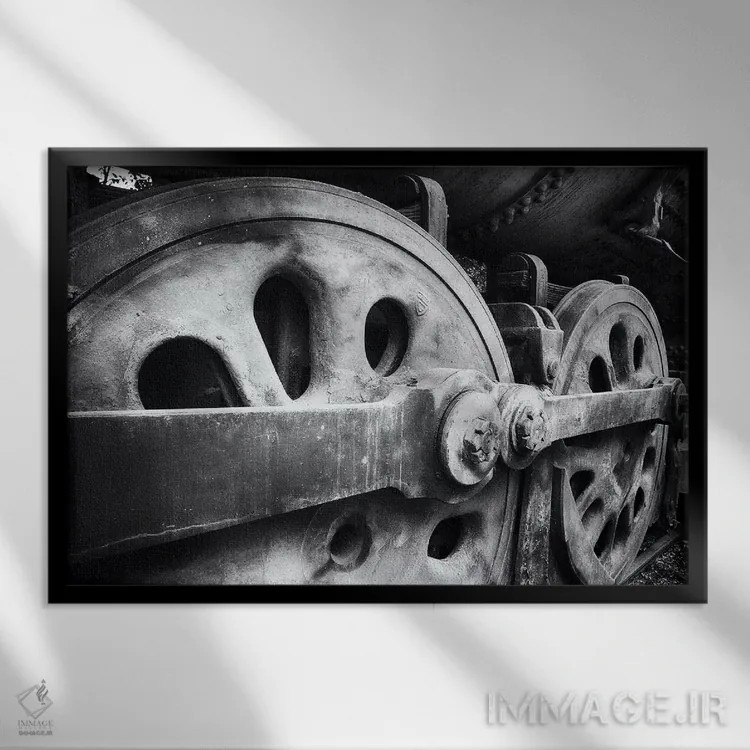 تابلو دکوراتیو نمای نزدیک از چرخ های لوکوموتیو فولادی اثر جورج اوزه - نمای قابدار مشکی