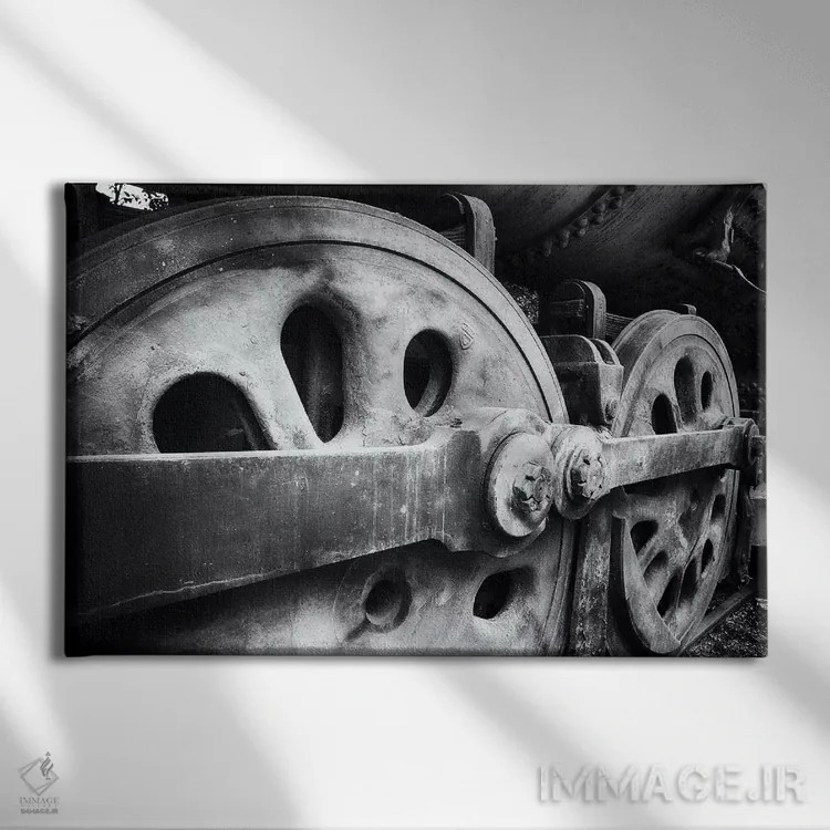 تابلو دکوراتیو نمای نزدیک از چرخ های لوکوموتیو فولادی اثر جورج اوزه - نمای روبهرو روی دیوار
