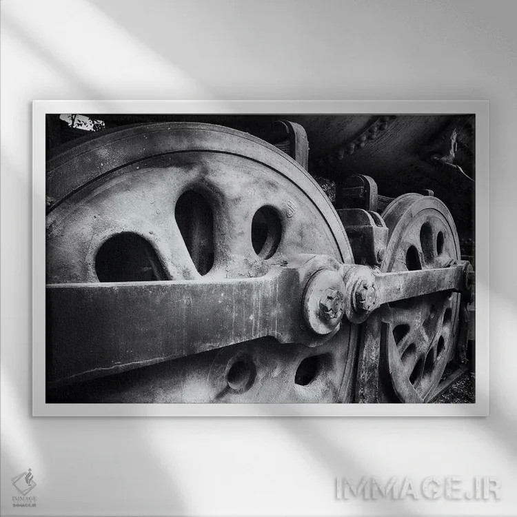 تابلو دکوراتیو نمای نزدیک از چرخ های لوکوموتیو فولادی اثر جورج اوزه - نمای قابدار سفید