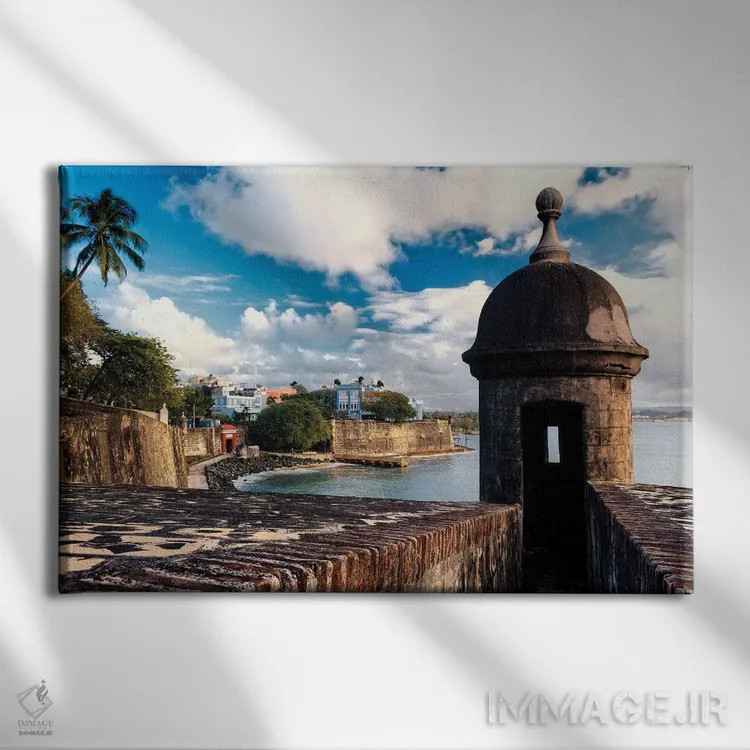 تابلو دکوراتیو نمای دیوارهای سن خوان قدیمی با برج نگهبانی در پیش زمینه، پورت… اثر جورج اوزه - نمای روبهرو روی دیوار