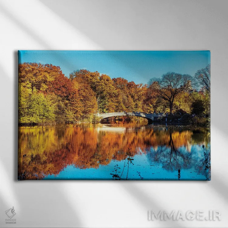 تابلو دکوراتیو انعکاس رنگ های پاییز بر دریاچه، سنترال پارک، نیویورک اثر جورج اوزه - نمای روبهرو روی دیوار