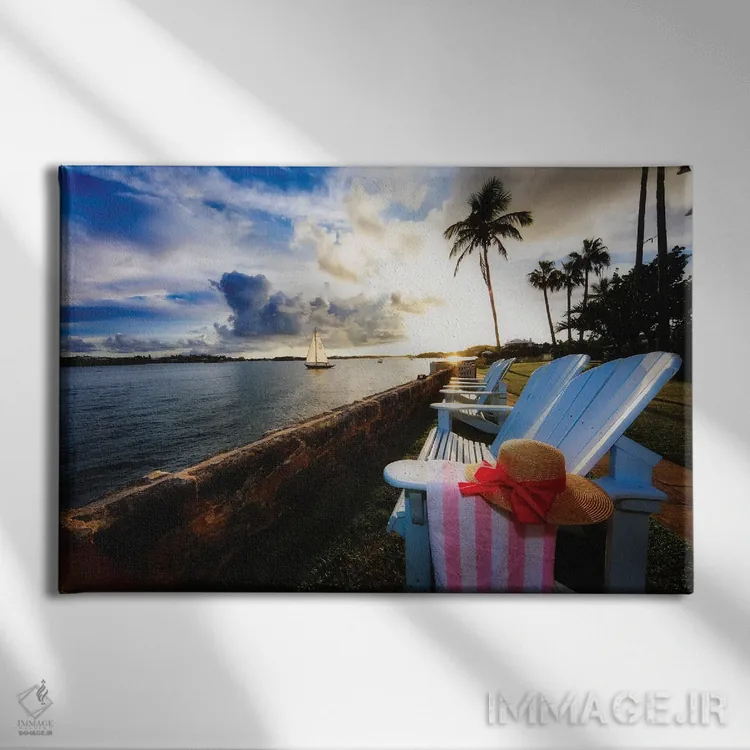 تابلو دکوراتیو غروب خلیج همیلتون با صندلی های راحتی، برمودا اثر جورج اوزه - نمای روبهرو روی دیوار