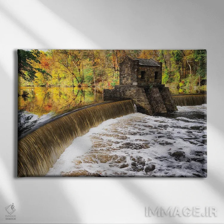 تابلو دکوراتیو سد و آبشار روی دریاچه اسپیدول در پاییز، نیوجرسی اثر جورج اوزه - نمای روبهرو روی دیوار