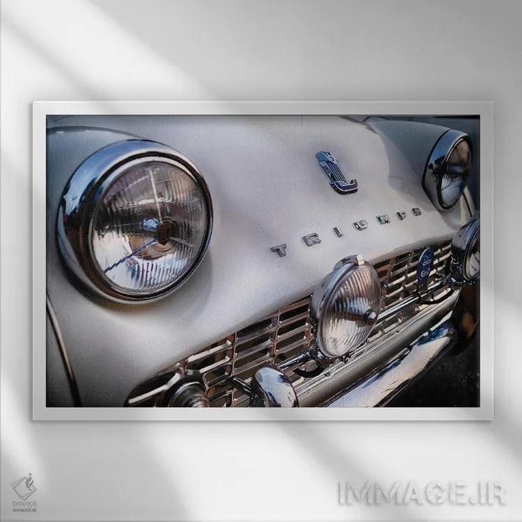 تابلو دکوراتیو نمای نزدیک از جلو خودروی اسپرت بریتانیایی کلاسیک ترایومف TR3… اثر جورج اوزه - نمای قابدار سفید