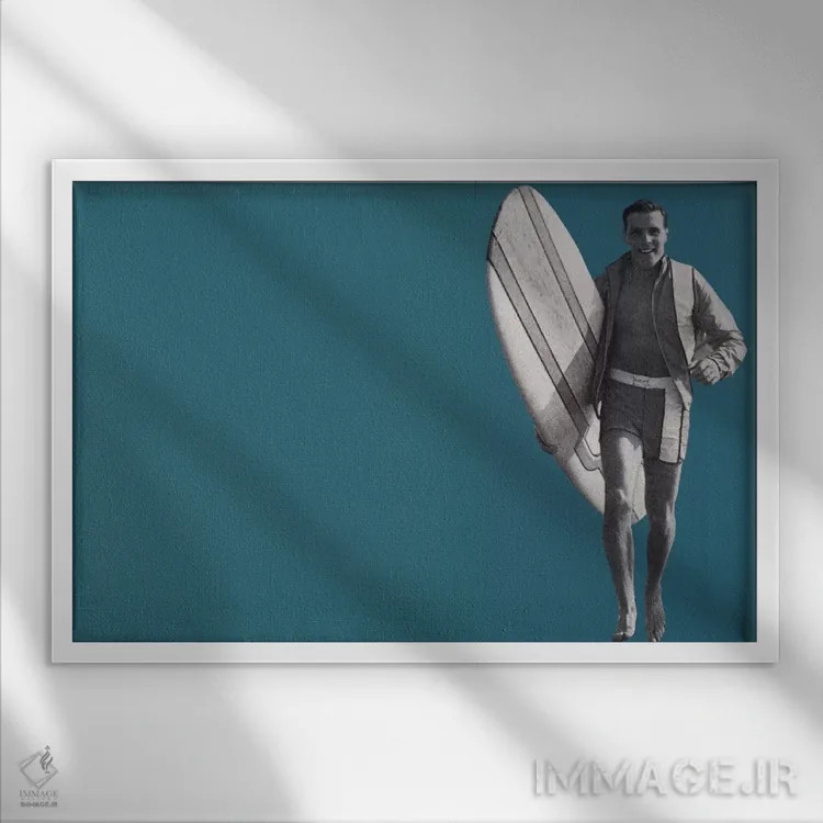 تابلو دکوراتیو پسر موج سوار اثر همینگوی دیزاین - نمای قابدار سفید