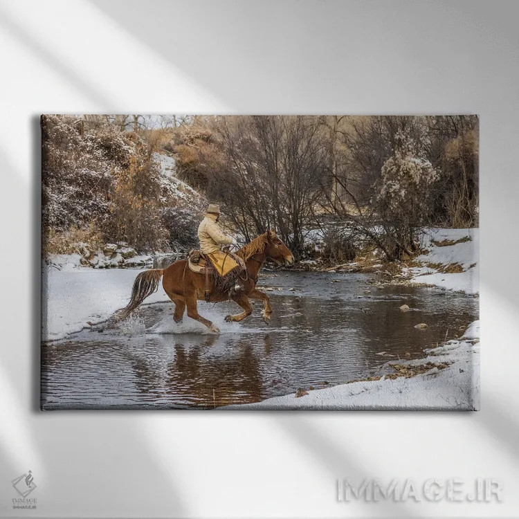 تابلو دکوراتیو Wyoming Hideout Horse Ranch, Wrangler Crossing The Stream On… اثر هولیس لونی - نمای روبهرو روی دیوار