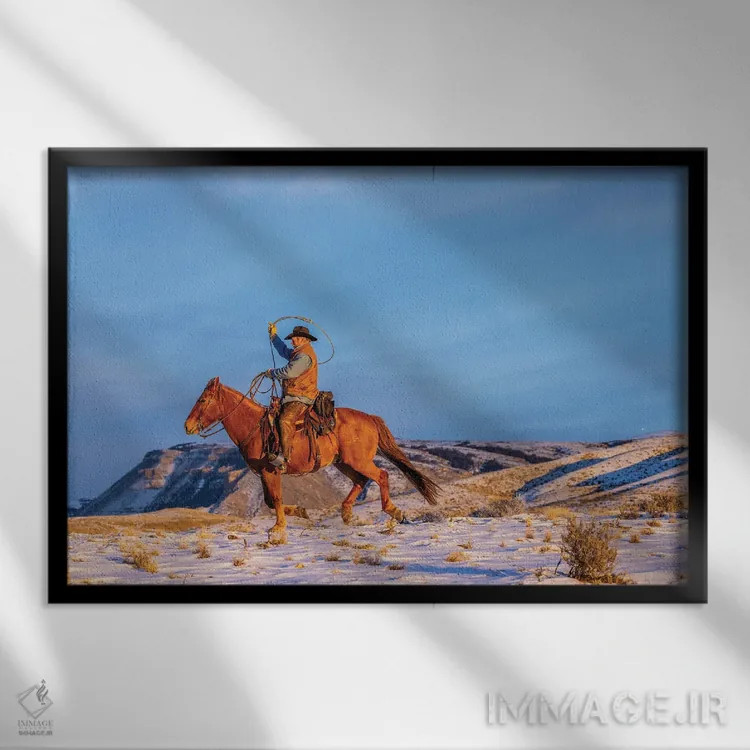 تابلو دکوراتیو Wyoming Hideout Horse Ranch, Wrangler And Horse In Snow,آمری… اثر هولیس لونی - نمای قابدار مشکی