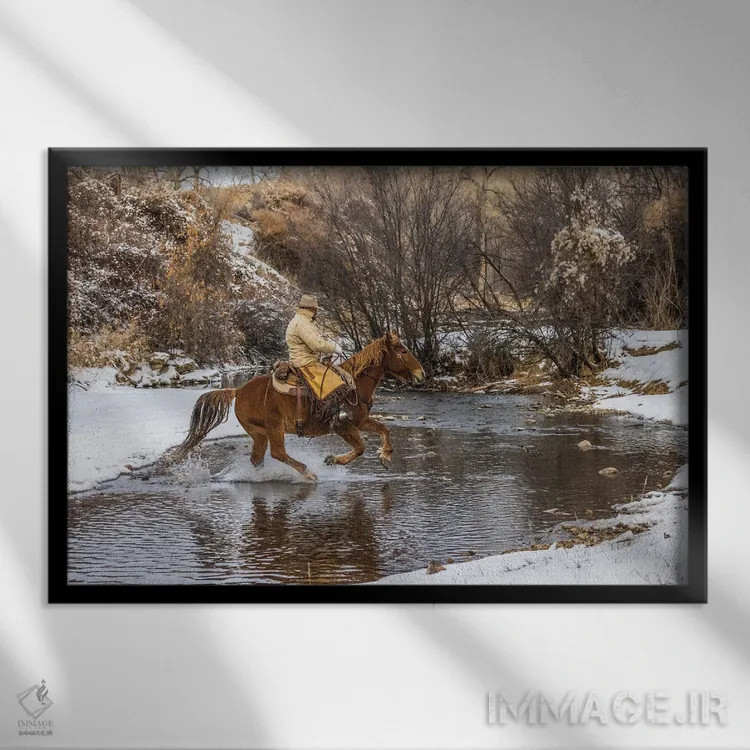 تابلو دکوراتیو Wyoming Hideout Horse Ranch, Wrangler Crossing The Stream On… اثر هولیس لونی - نمای قابدار مشکی