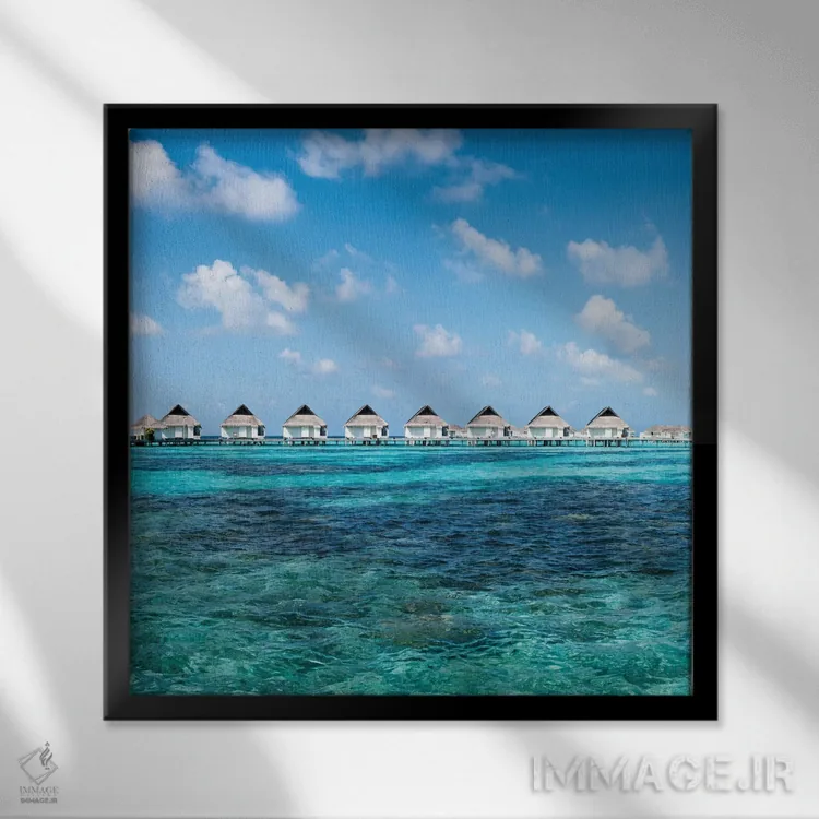 تابلو دکوراتیو ویلاهای روی آب در یک اقامتگاه لوکس ساحلی در مالدیو اثر یان بکه - نمای قابدار مشکی