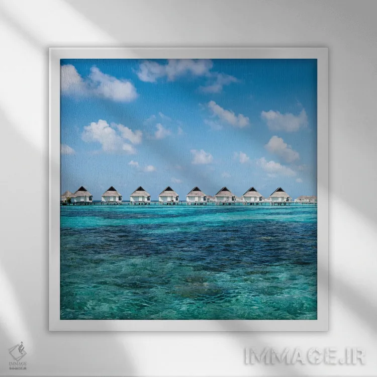 تابلو دکوراتیو ویلاهای روی آب در یک اقامتگاه لوکس ساحلی در مالدیو اثر یان بکه - نمای قابدار سفید
