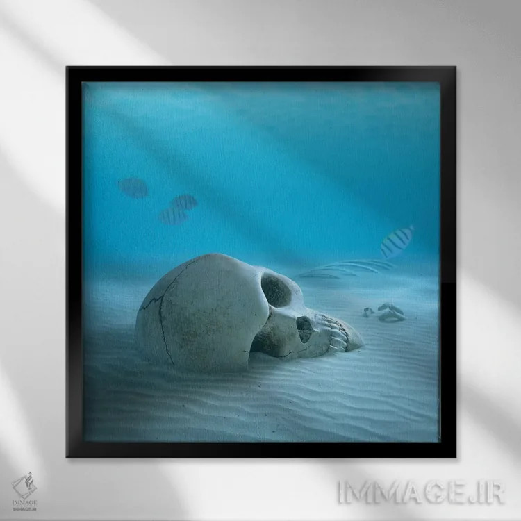 تابلو دکوراتیو جمجمه در کف شنی اقیانوس همراه با ماهی های کوچک که استخوا… اثر یوهان سوانپوئل - نمای قابدار مشکی