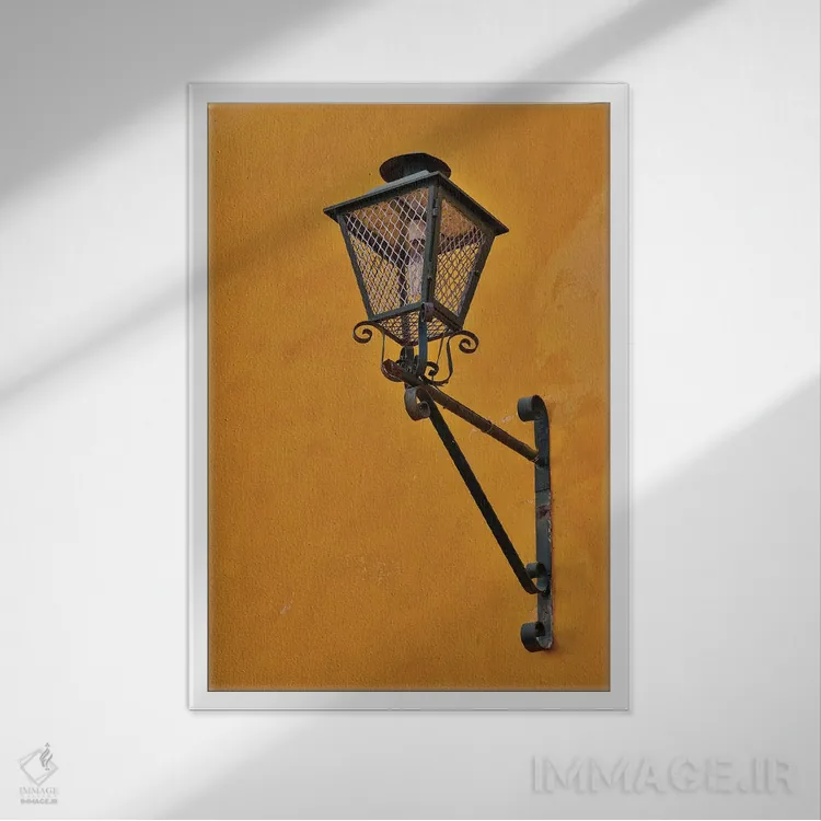 تابلو دکوراتیو Mexico. Lantern and shadow on colorful buildings,سن میگوئل د… اثر دارل گالین - نمای قابدار سفید