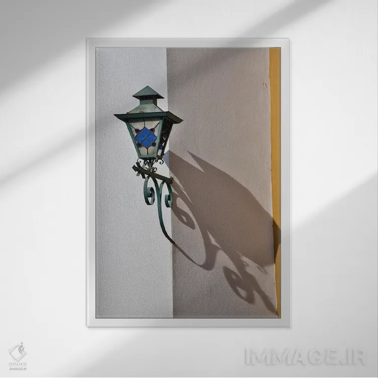 تابلو دکوراتیو Mexico. Lantern and shadow on colorful buildings,سن میگوئل د… اثر دارل گالین - نمای قابدار سفید