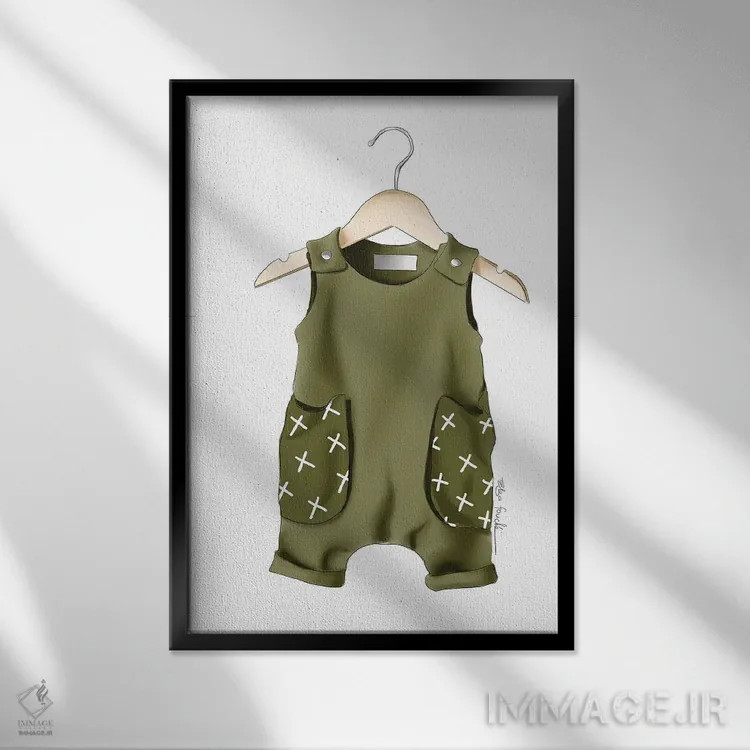 تابلو دکوراتیو لباس نوزاد پسر اثر الزا فوچه - نمای قابدار مشکی