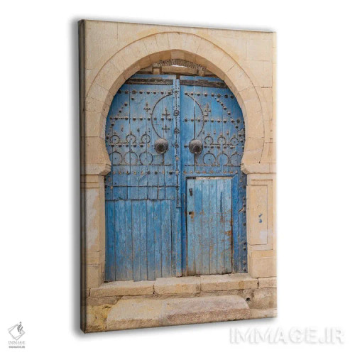 تابلو دکوراتیو Tunisia. A Blue Door In A Keyhole Arch, Also Known As A… اثر امیلی ام ویلسون - نمای پرسپکتیو محصول