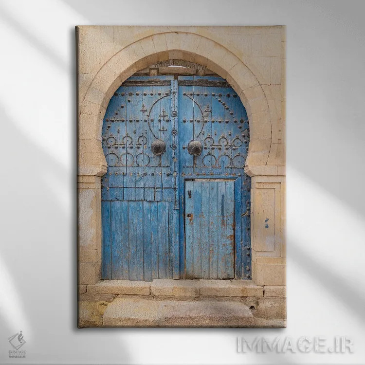 تابلو دکوراتیو Tunisia. A Blue Door In A Keyhole Arch, Also Known As A… اثر امیلی ام ویلسون - نمای روبهرو روی دیوار