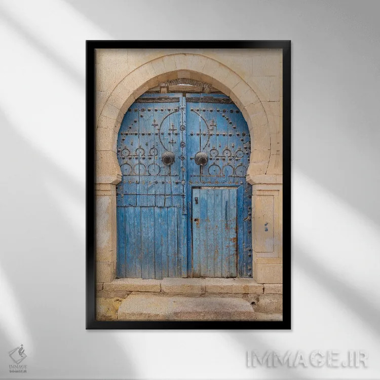 تابلو دکوراتیو Tunisia. A Blue Door In A Keyhole Arch, Also Known As A… اثر امیلی ام ویلسون - نمای قابدار مشکی