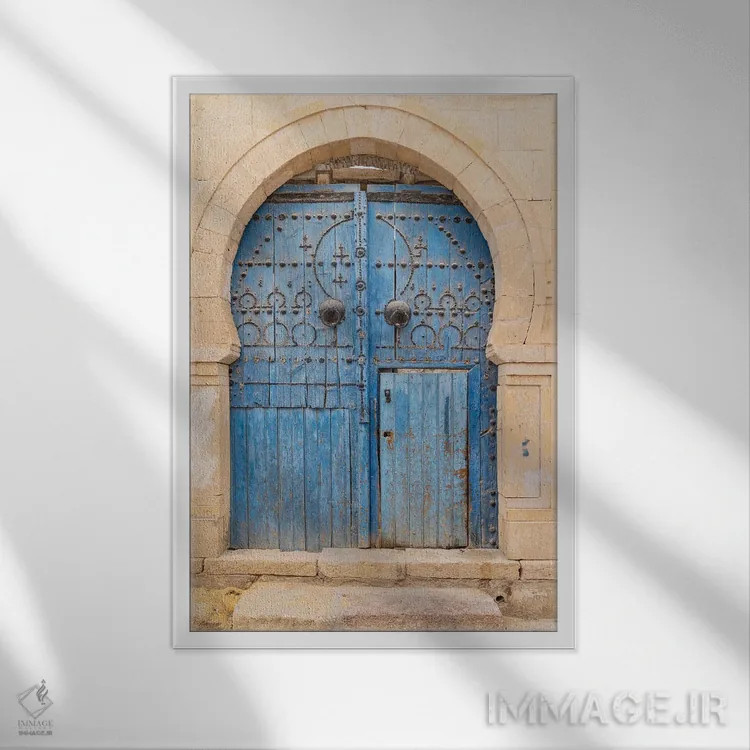 تابلو دکوراتیو Tunisia. A Blue Door In A Keyhole Arch, Also Known As A… اثر امیلی ام ویلسون - نمای قابدار سفید