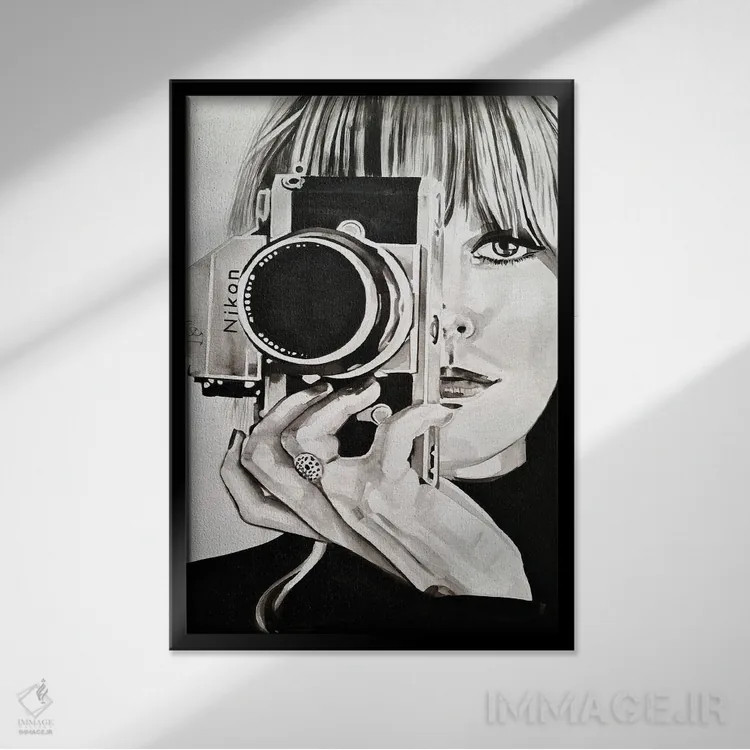 تابلو دکوراتیو گرفتن اثر گیل لبلو - نمای قابدار مشکی