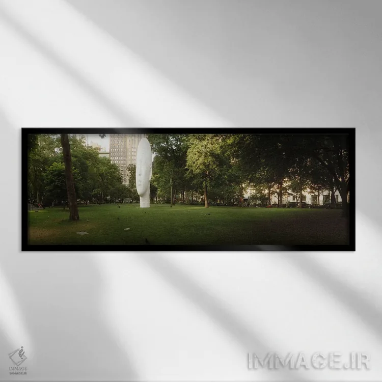 تابلو دکوراتیو مجسمه سر بزرگ در یک پارک، پارک مادیسون اسکوئر، میدان ما… اثر پانورامیک ایمجز - نمای قابدار مشکی