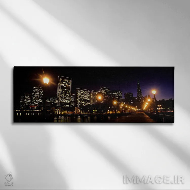 تابلو دکوراتیو ساختمان ها در کنار آب روشن شده در شب، سانفرانسیسکو، کال… اثر پانورامیک ایمجز - نمای روبهرو روی دیوار